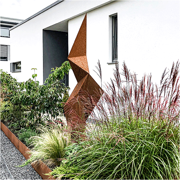 Large outdoor sculpture in corten steel abstractly depicting the shape of a polygonised sea Kelp leaf