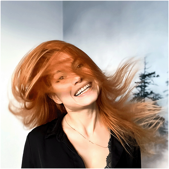 Portrait of the designer in a movement, with flying hair